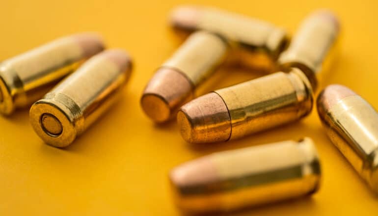 Bullets on a yellow surface.