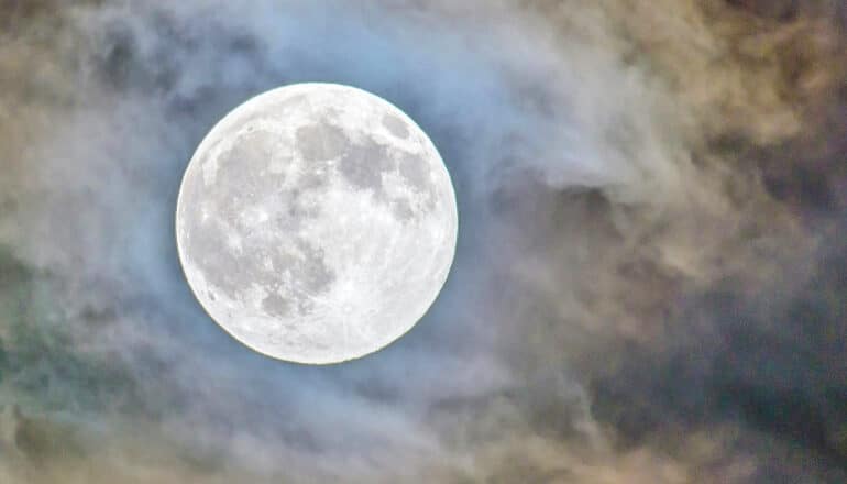 The moon with clouds around it.