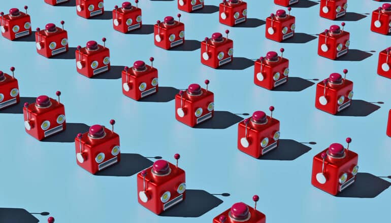 Rows of small red robot heads on a blue background.