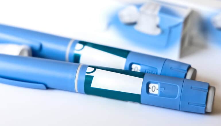 Weight-loss drug injection pens sit on a white background.