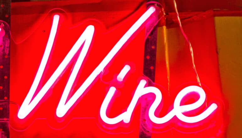 A neon sign reads "Wine."