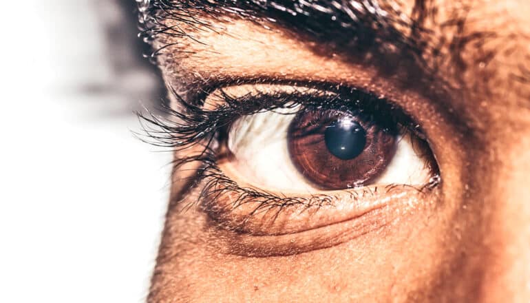 A close-up of a young man's eye.