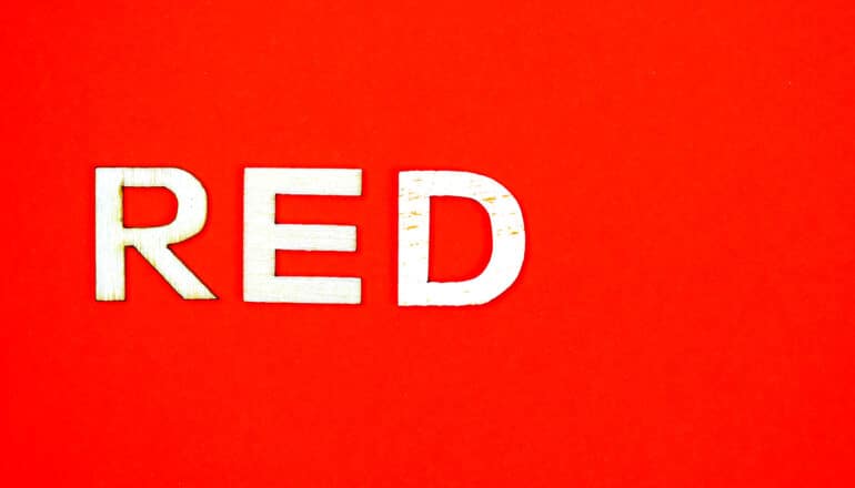 The word "red" is written in white on a red background.